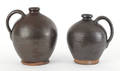 Two Berks County Pennsylvania redware jugs 19th c