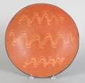 Large slip decorated redware charger 19th c