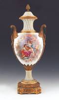 Large Sevres style ormolu mounted porcelain urn with hand painted scene of a man and woman surrounded by putti
