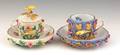 Two Meissen flower encrusted cups and saucers