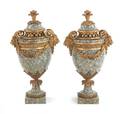 Pair of French ormolu mounted marble urns with rams head handles