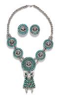 A Sterling Silver and Turquoise Sunface Kachina Doll Motif Demi Parure Larry Moses Begay Navajo