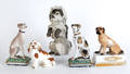 Five Continental porcelain dogs late 19thearly 20th c