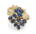 A 14 Karat Yellow Gold Sapphire and Diamond Spray Ring