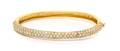 An 18 Karat Yellow Gold and Diamond Bangle Bracelet