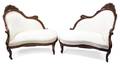 A Pair of Rococo Revival Laminated Rosewood Love Seats