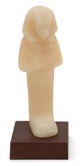 An Egyptian Carved Alabaster Figure of a Pharaoh