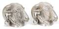 A Pair of Silvered Metal Rams Head Wall Mounts