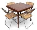 A WoodenTop Folding Table With Four CaneBack Folding Chairs