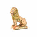 Terra cotta lion lawn ornament