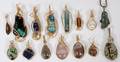 FIFTEEN WIRE GOLD AND STONES PENDANTS