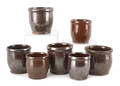 Seven Pennsylvania redware crocks 19th c
