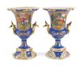 Pair of porcelain urns with hand painted courting scenes