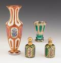 Four pieces of Bohemian glass to include a large ruby vase