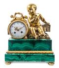 A French Gilt Bronze and Malachite Mounted Figural Mantel Clock