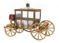 A Viennese Enameled Gilt Metal Musical Model of a Coach