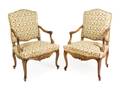 A Pair of Louis XV Style Walnut Fauteuils