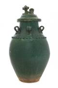 A Green Glazed Earthenware Covered Jar
