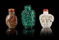 Three Carved Hardstone Snuff Bottles
