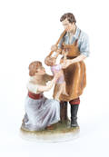Royal Dux figure of a blacksmith and family
