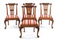 Set of four George III style carved dining chairs