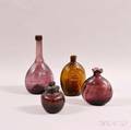 Four Colored Glass Bottles and Flasks