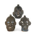 Three Georgia stoneware face jugs by Chester Hewell