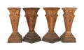 Set of four carved oak pedestals