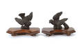 Pair of rosewood and mahogany bird wall mounts