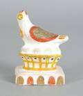 Chalkware figure of a bird on a nest 19th c