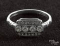 Platinum and diamond ring with a rectangular head containing a row of four round