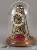 Brass skeleton clock with a dome