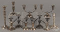Twelve sterling silver weighted candlesticks and candelabra