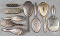 Eight sterling silver mounted dressing articles