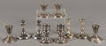 Five pairs of weighted sterling silver candlesticks