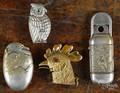 Four figural match vesta safes