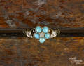 Early 14K yellow gold ring with five turquoise cabochons in the shape of a flower and five diamond accents