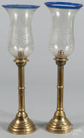 Pair of European brass candlesticks with etched glass shades
