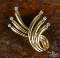 Dankner 14K yellow gold brooch with six diamond terminations