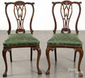 Pair of George III style carved mahogany slipper chairs