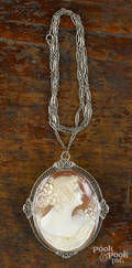 Large shell cameo pendantbrooch with a 14K white gold filigree frame and a 14K white gold chain