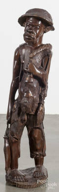 African carved figure of a fishmonger