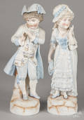 Pair of bisque figures of a boy and girl in blue