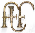 Three large brass swan head faucets