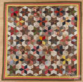 Pieced tumbling block quilt