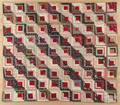 Pieced log cabin quilt
