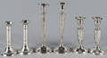 Three pairs of weighted sterling silver candlesticks