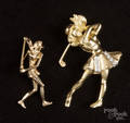 Two yellow gold female golfer pendants