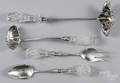 Four silverplate and cut glass serving utensils