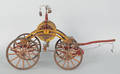 Painted wood model of a hand drawn hose reel carriage ca 1900